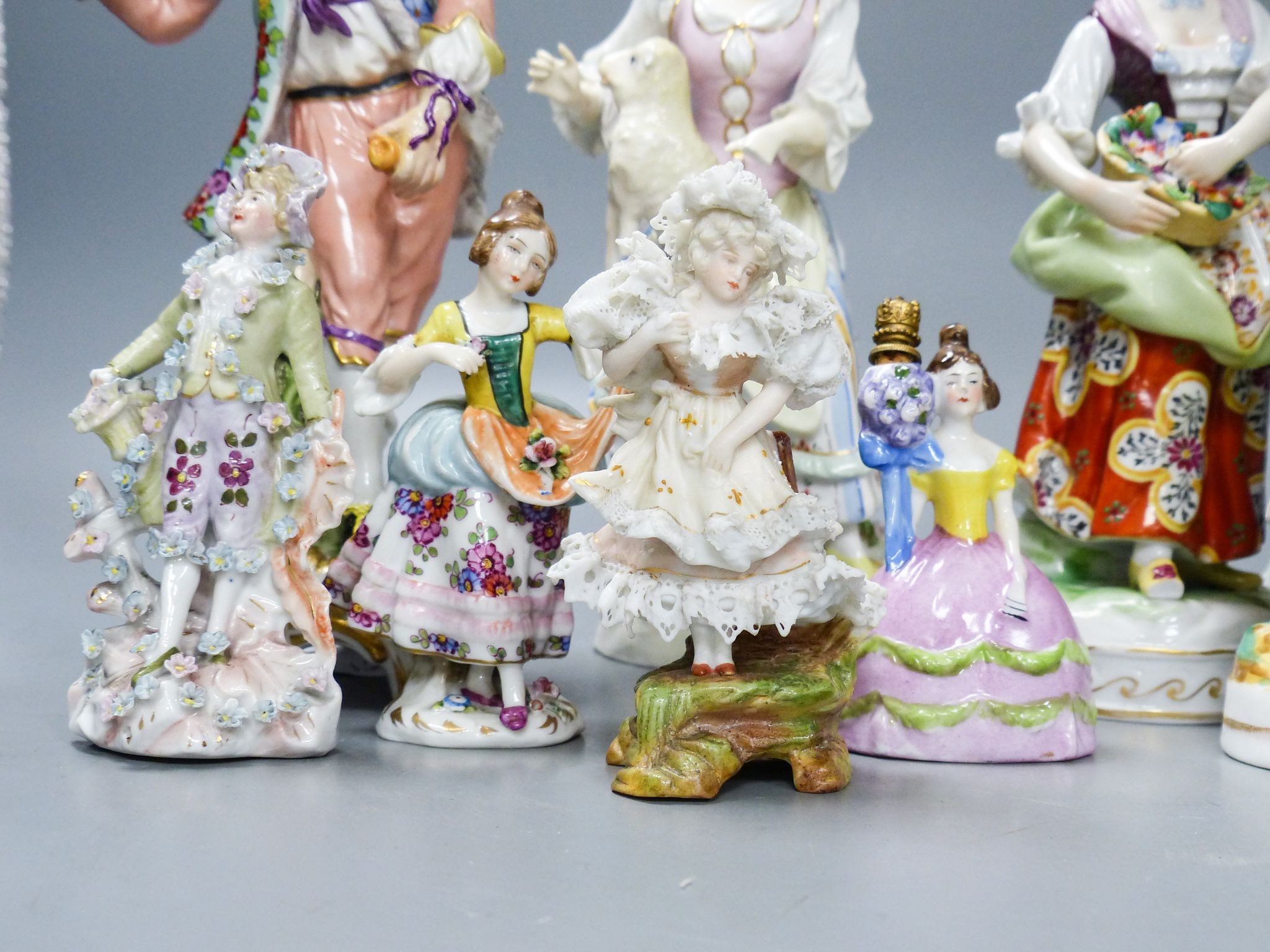 Ten Continental porcelain figures or groups, 19th/20th century, including a Berlin figure of a gentleman, tallest 23 cm